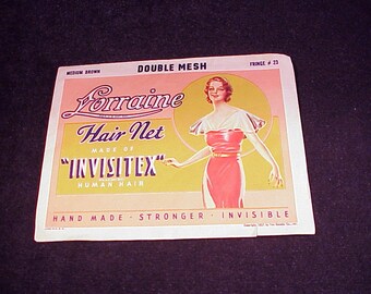 May include: A vintage label for Lorraine Hair Net, made of "InvisiteX" human hair. The label features a woman in a pink dress and a white collar, with the text "Double Mesh", "Fringe # 23", "Medium Brown", "Hand Made", "Stronger", and "Invisible".