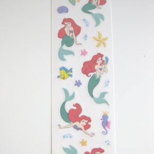 Stickers vélin Disney La petite sirène Lion des sables scintillants - 1 feuille - 18 autocollants