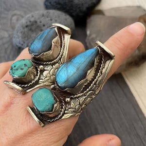 Elevate your style with our big, chunky rings. Designed for those who love bold fashion and aren’t afraid to stand out! Made from alloy metal, Labradorite and Turquoise stones, creating a eye catching designs. These statement rings add personality and flair to any outfit. Whether you're dressing up for a special occasion or adding a unique touch to your everyday look, these rings are the perfect accessory.
