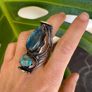 Elevate your style with our big, chunky rings. Designed for those who love bold fashion and aren’t afraid to stand out! Made from alloy metal, Labradorite and Turquoise stones, creating a eye catching designs. These statement rings add personality and flair to any outfit. Whether you're dressing up for a special occasion or adding a unique touch to your everyday look, these rings are the perfect accessory.