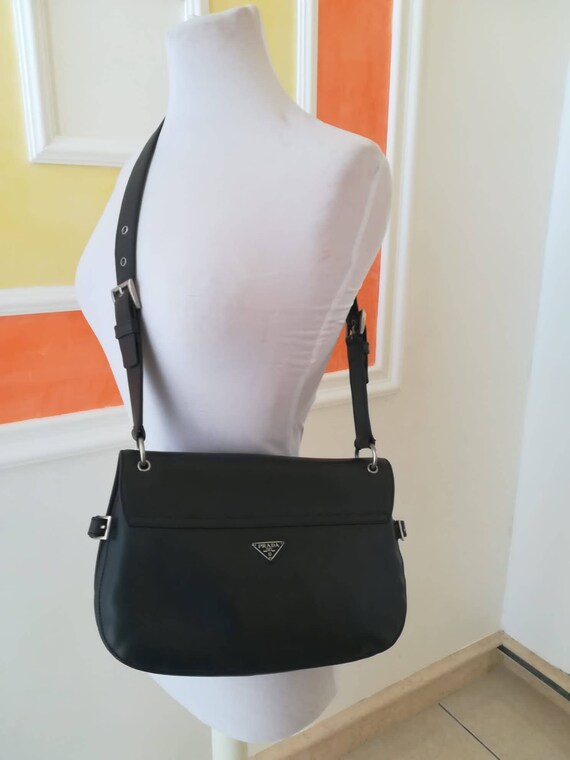 Prada, blue leather post bag bag.