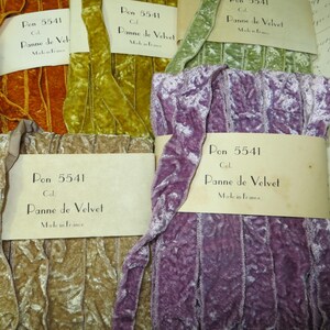 May include: A selection of panne velvet ribbon spools in various colours, including orange, green, gold, tan, and purple. Each spool is labelled with "Pon 5541 Cal. Panne de Velvet Made in France."
