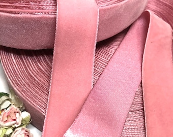 May include: Two rolls of pink velvet ribbon, one with a satin finish and one with a velvet finish.
