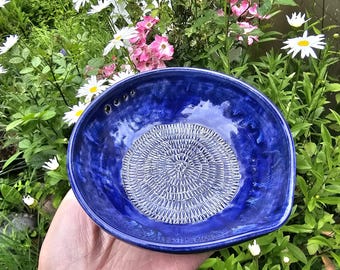 Garlic grater herb stripper.  Handmade pottery.  Blue glazing.