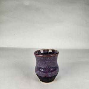 4 oz Viking aquavit.  Shotglass.  Purple and black glazing.  Handmade pottery. Anglo Saxon