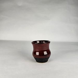 4 oz Viking aquavit.  Shotglass.  Red and black glazing.  Handmade pottery. Anglo Saxon