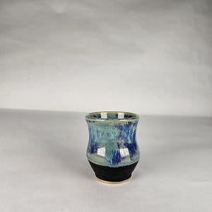 4 oz Viking aquavit.  Shotglass.  Blue/purple and black glazing.  Handmade pottery. Anglo Saxon