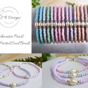 May include: A set of pastel-coloured bracelets made with frosted seed beads and freshwater pearls. The bracelets are stacked on top of each other, showing the different colours and patterns. The text "FJ B Designs Jewellery" is visible in the top left corner of the image.