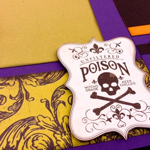 May include: A white label with a skull and crossbones design. The label reads "Unfiltered Poison Witch's Grade Keep Chilled".