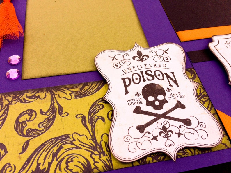 May include: A white label with a skull and crossbones design. The label reads "Unfiltered Poison Witch's Grade Keep Chilled".