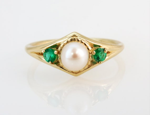 Pearl and shop emerald engagement ring