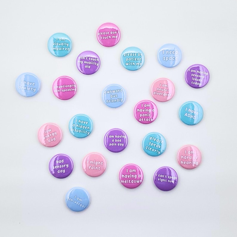 Pastel pinback buttons with text: I need space, I am having a bad pain day, I have mobility Issues, low energy day, please don't touch me, don't touch my mobility aid, please speak clearly, I can't speak right now, I am non-verbal, I have mobility issues, I am having sensory issues today, bad sensory day, I am hard of hearing, I might faint, please be patient with me, awkward but friendly, I can't speak right now, I am neurodivergent, situationally non-speaking, I am having a meltdown