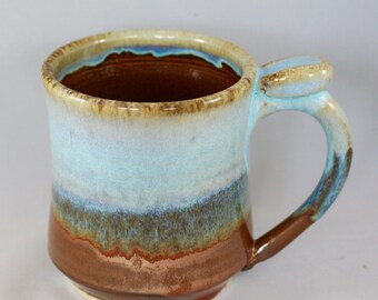 Large stoneware pottery mug with thumb rest, copper and light blue glaze, ginkgo leaf stamp (12 oz)