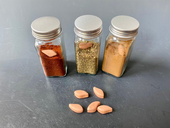 The Simple Reason Your Spice Jars Are Clumped Up