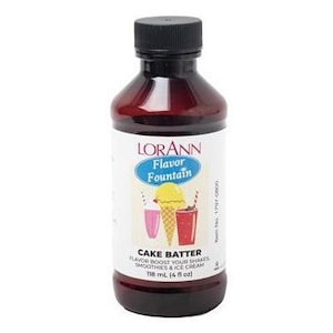 May include: A brown glass bottle with a black cap labeled "LORANN Flavor Fountain Cake Batter Flavor Boost Your Shakes Smoothies & Ice Cream 118 ml. (4 fl oz)"