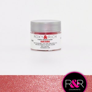 May include: A small jar of red sparkle dust labeled "ROXY&RICH HYBRID SPARKLE DUST RUBY/RUBIS FDA FOOD COLOUR MAX 1.25% INGR: MICA (E555, E171) AND ONE OR MORE OF THE FD&C COLOURS ROXY & RICH INC. ROXYANDRICH.COM"