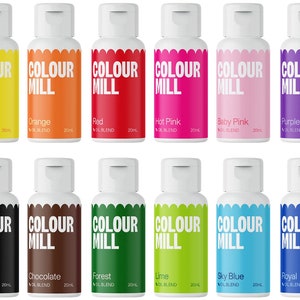 May include: Twelve 20 ml bottles of oil-based food coloring in various colors, including yellow, orange, red, hot pink, baby pink, purple, black, chocolate, forest green, lime, sky blue, and royal blue. Each bottle has a white cap and a label that says "COLOUR MILL" and the color name.