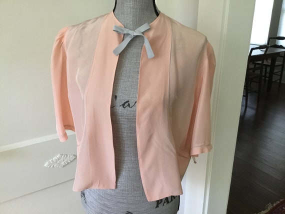 Vintage peachy pink bed jacket