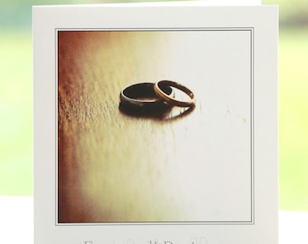 Silver/platinum and gold wedding/engagement/civil partnership rings photograph, blank inside, square greetings card