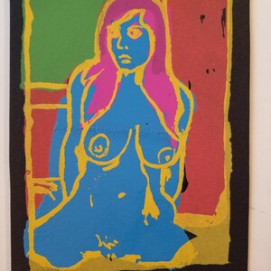 May include: A colorful screen print on black paper featuring a woman with pink hair and a blue body. The image is framed with a yellow border and has the text "1/8 RL STEELE" in the bottom left corner.