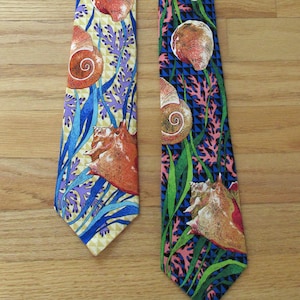 May include: Two silk neckties with a seashell and seaweed pattern. One tie is yellow, blue, and purple. The other tie is blue, green, and pink.