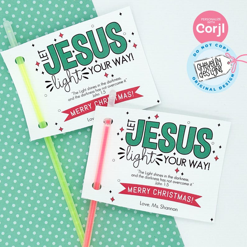 May include: Two white cards with a green and white design. The cards have the text "Let Jesus light your way!" and a Bible verse. The cards are attached to glow sticks. The cards are on a green background with white polka dots.