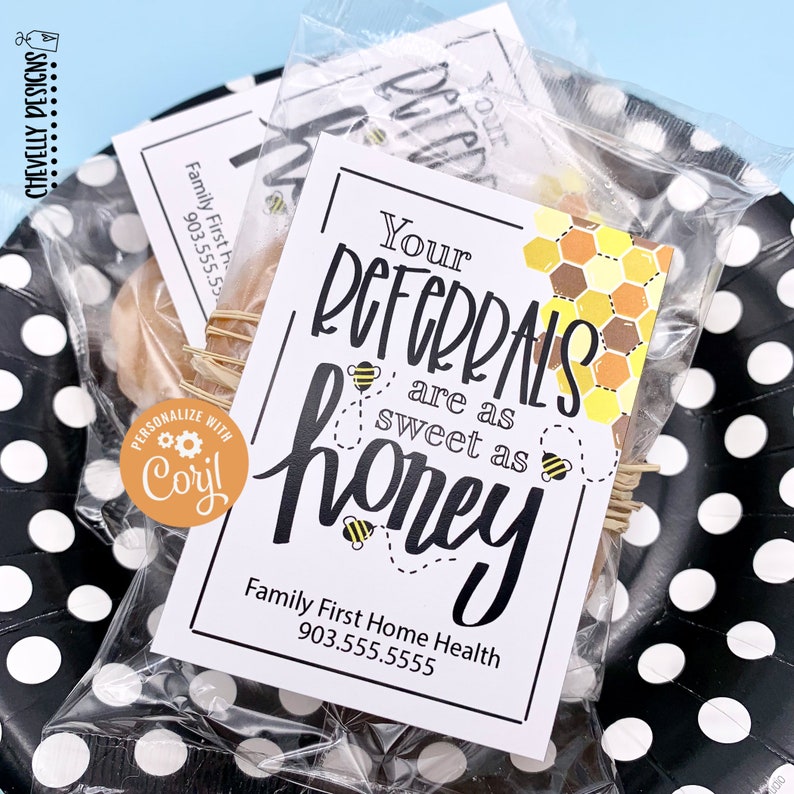 May include: A white card with black text that reads "Your Referrals are as sweet as honey" with a honeycomb design and bees. The card is in a clear plastic bag with a small jar of honey.