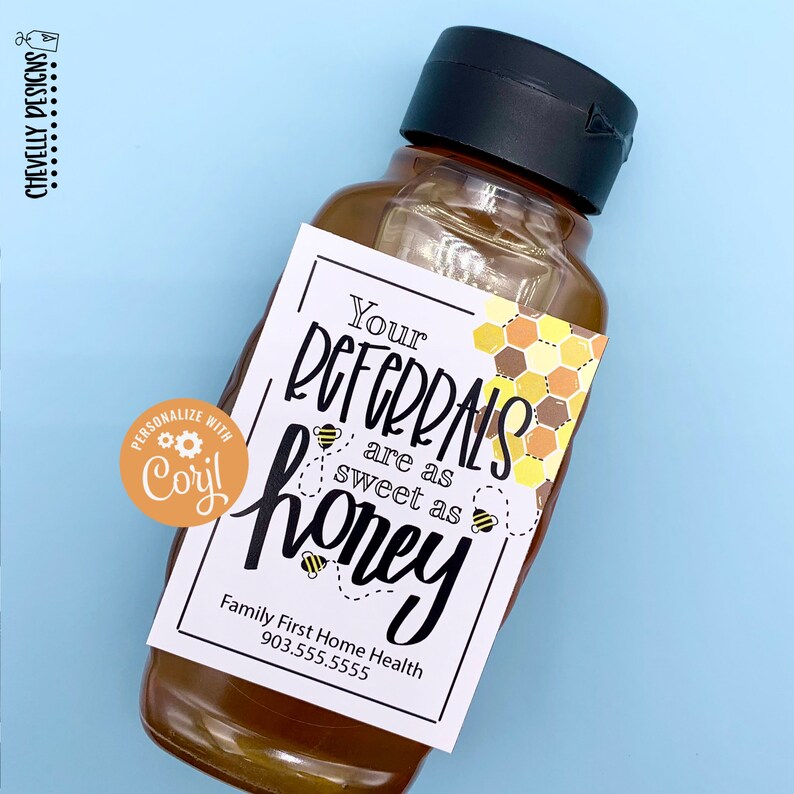 May include: A small bottle of honey with a white label that reads "Your referrals are as sweet as honey" with a honeycomb pattern and bees. The label also includes the text "Family First Home Health 903.555.5555".