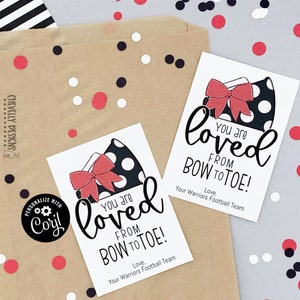 May include: Two white cards with black polka dot bows and the text "You are loved from bow to toe!" with the words "Love, Your Warriors Football Team" at the bottom of each card.