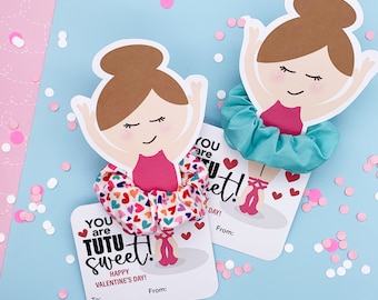 May include: Two printable Valentine's Day cards featuring a ballerina with a pink tutu and a scrunchie. The cards say "You are tutu sweet!" and "Happy Valentine's Day!"