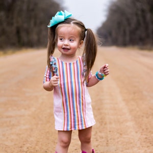 Baby Autumns Knit ruffle top and shift dress for toddlers and girls sizes 2t-12. PDF sewing pattern with projector file.