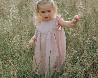 Aspen's V bodice tie back Romper, Top and dress for toddler and girl sizes 2t-12. PDF sewing pattern with projector file.