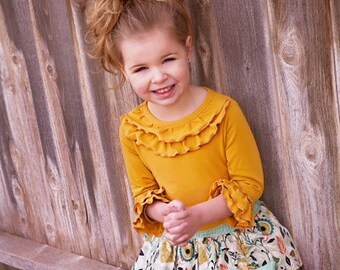 Cheyenne's Ultimate Ruffle Tshirt. PDF sewing pattern for toddler girl sizes 2t - 12.