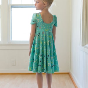 Adelyn's Scoop back knit/ woven tunic and dress. PDF sewing pattern for toddler girl sizes 2t 12. image 1