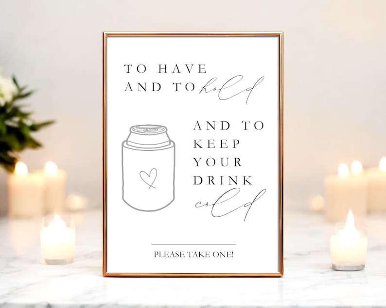 May include: A rectangular sign in a thin copper frame featuring black text that reads TO HAVE AND TO hold AND TO KEEP YOUR DRINK cold and PLEASE TAKE ONE! with a line drawing of a beverage can cooler featuring a small heart outline.