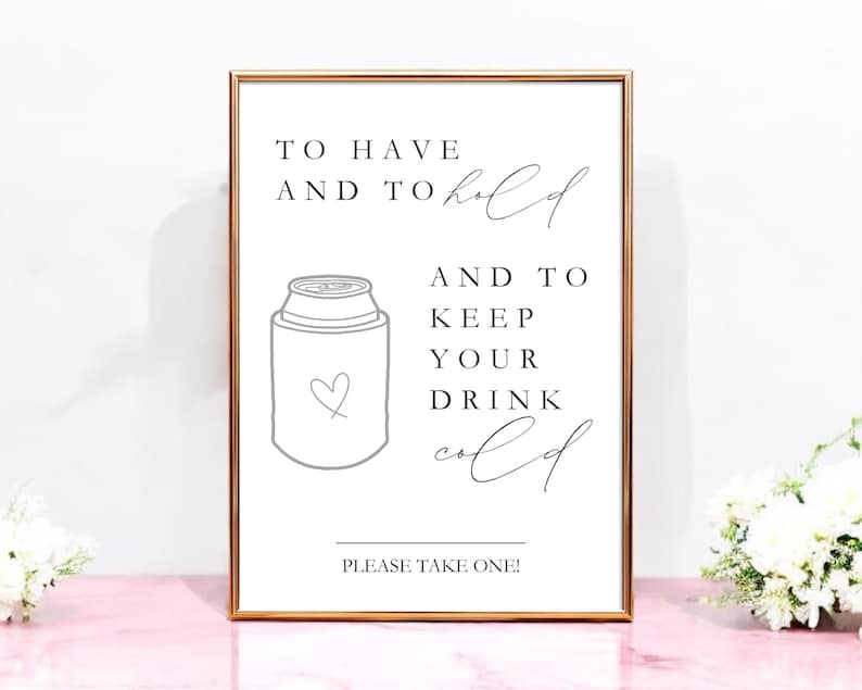 May include: A rectangular sign in a thin metallic frame featuring black text that reads TO HAVE AND TO hold AND TO KEEP YOUR DRINK cold PLEASE TAKE ONE! with a line drawing of a beverage cooler featuring a small heart icon on the front.
