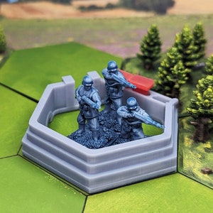 May include: Three blue plastic toy soldiers standing in a gray plastic bunker with a red plastic wall behind them. The bunker has three steps and is hexagonal in shape.