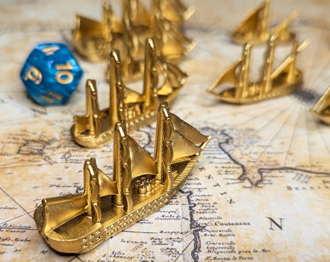 Featured listing image: Golden Treasure Ships Merchants & Marauders Set of 7 Board Game Tokens | Custom Meeple, Sailing Ships, Pirates Privateers, Pirate Borg