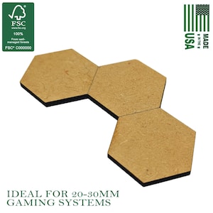 May include: Three hexagonal wooden tiles with black edges, arranged in a connected pattern. The tiles are light brown and appear to be made of wood. The image also includes the text "MADE IN THE USA" and "FSC" logo.