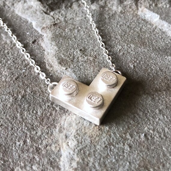 Lego necklace meaning deals