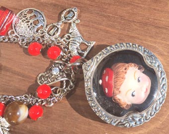 Vintage little red ridding hood doll necklace. wearable art. Creepy cute unique statement necklace. Silver and red jewellery.