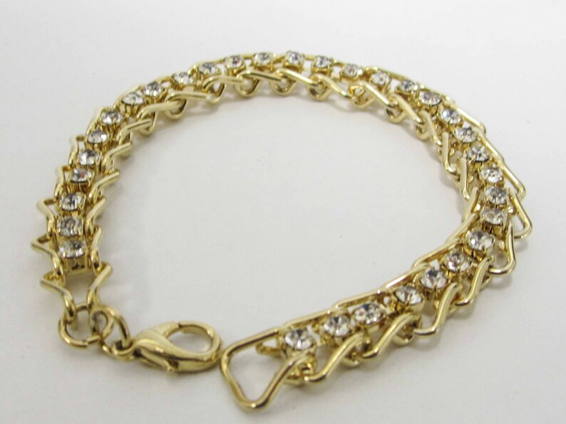 ONE GOLD plated bracelet with crystals