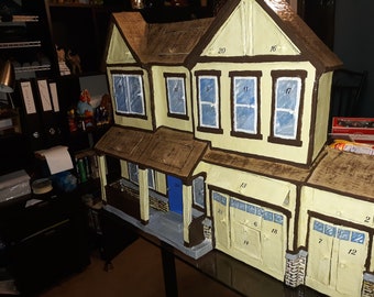 3-D Advent Calendar of your House or any building you desire with large doors and deep hidey holes