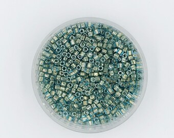 Toho 990, 3mm cube, Bronze Lined Aqua, 30 grams