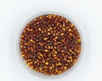 Toho 34, 3mm cube, Silver Lined Dark Gold, 30 grams