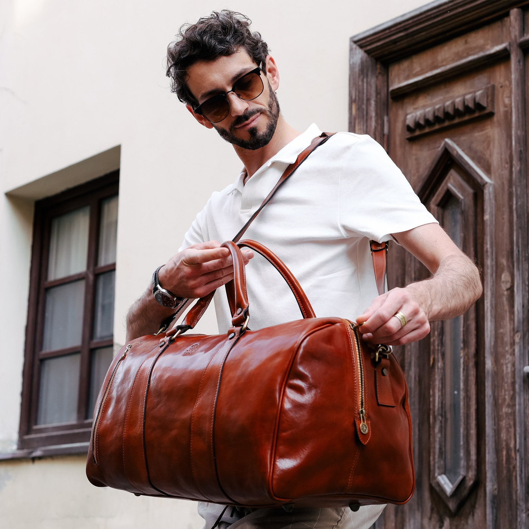 brown leather duffle bag