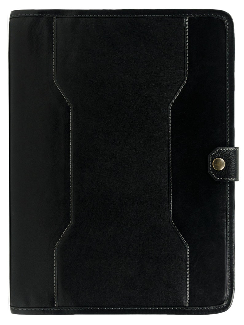 May include: Black leather notebook with a stitched design and a metal button closure.