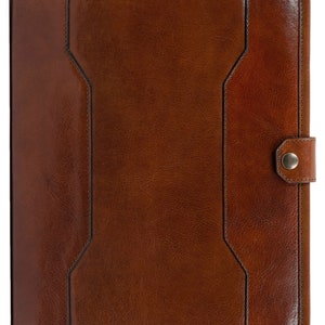 May include: A brown leather portfolio with a flap closure and a metal button. The portfolio has a textured surface and a stitched design.