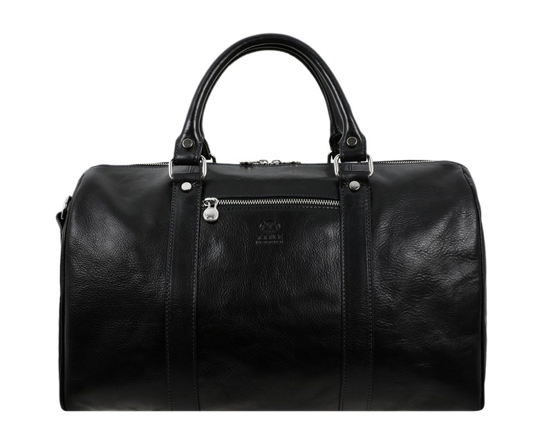 May include: A black leather duffel bag with silver hardware and a zipper closure. The bag has a top handle and a shoulder strap. The bag has a small logo on the front that reads 'ARBEIT'.