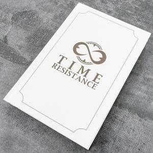 May include: A rectangular white box featuring a thin black border with decorative corners. Centered on the lid is a brown logo consisting of an infinity symbol intertwined with a clock face, positioned above the text TIME RESISTANCE.